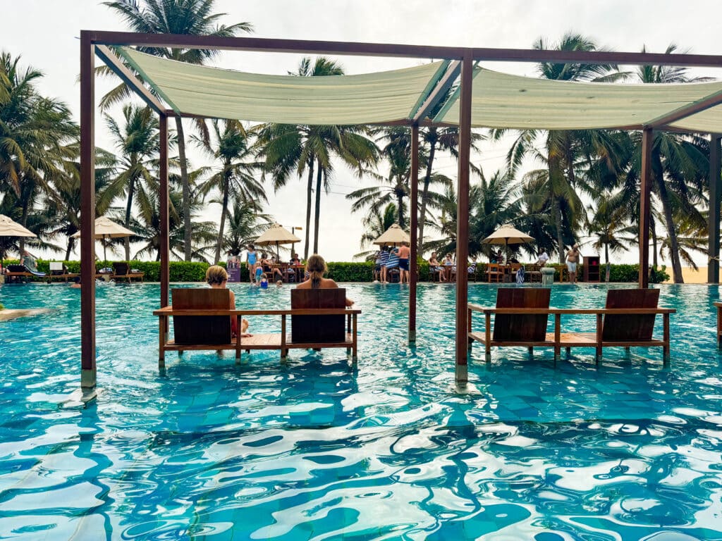 Weather in Sri Lanka in March: Complete Travel Guide & Climate Overview 2 Pool area at a beachfront resort in Negombo with palm trees and ocean views along Sri Lanka’s west coast.
