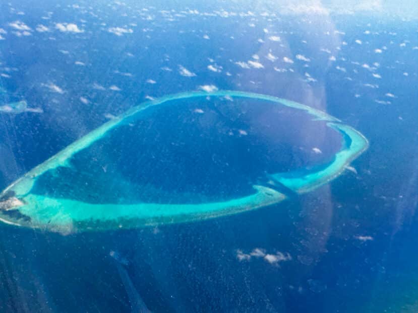 Baa Atoll Maldives: The Complete Guide to Baa and Raa Atoll 1 Baa Atoll Maldives UNESCO Biosphere Reserve aerial view coral atoll with turquoise lagoon