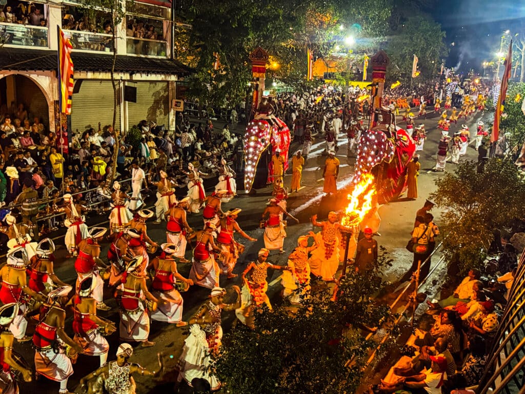 Esala Perahera Festival in Kandy: What It Is, How It Works & Where to Stay 2 Kandyan dancers and drummers leading the Esala Perahera procession at night