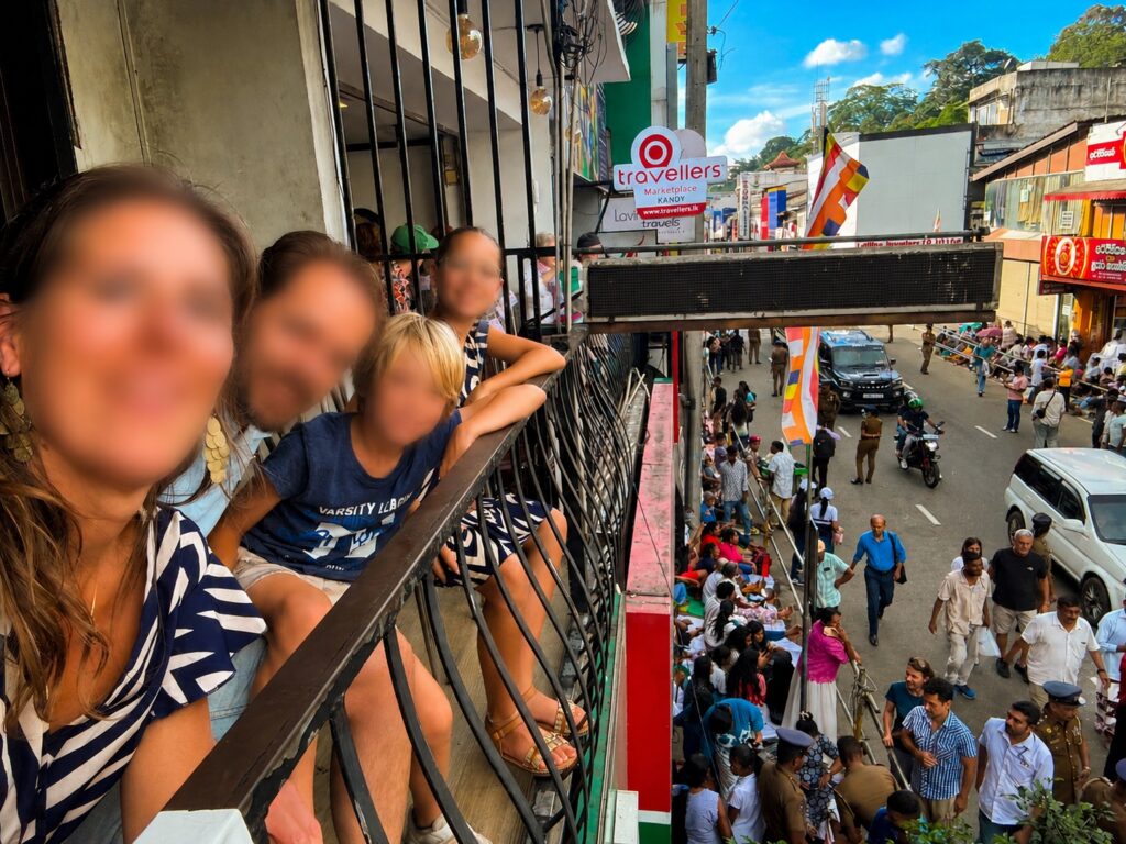 Esala Perahera Festival in Kandy: What It Is, How It Works & Where to Stay 4 Blurred view from elevated balcony overlooking the Kandy Perahera street below