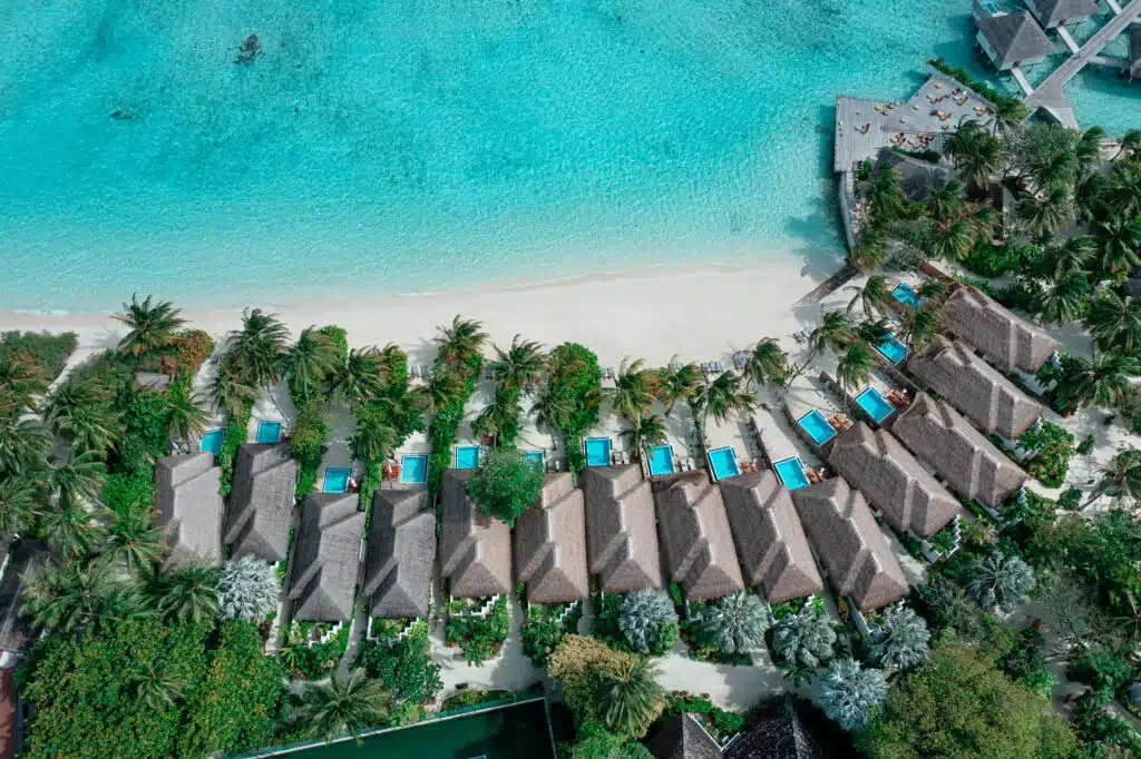 How to Choose a Maldives Resort: The Complete Decision Guide 11 aerial view of Velassaru Maldives beach pool villas along white sand beach close to Male atoll