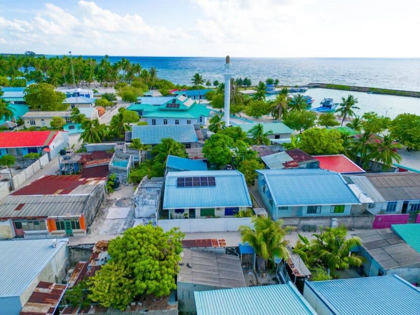 Lhaviyani Atoll Maldives: A Complete Guide to Three Stunning Atolls 20 Kendhoo local island Noonu Atoll Maldives beach with green trees and turquoise water