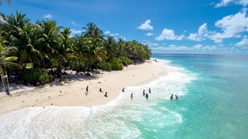 North and South Malé Atoll Guide (Kaafu Atoll): Resorts, Local Islands & Everything You Need to Know 35 Thulusdhoo local island Kaafu Atoll Maldives aerial view with surf beach and clear water