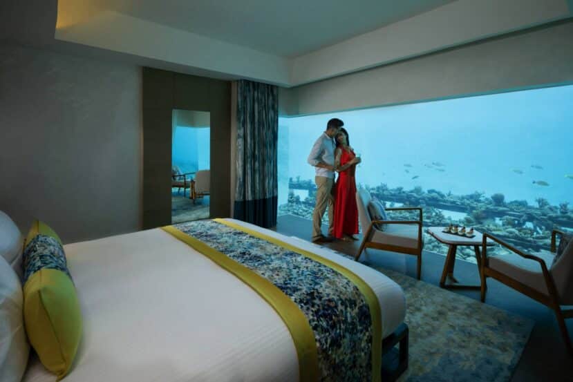 Southern Atolls Maldives: Your Complete Guide to Gaafu, Laamu, Thaa & Beyond 4 Pullman Maldives Maamutaa Resort overwater aqua villa couple with turquoise water views