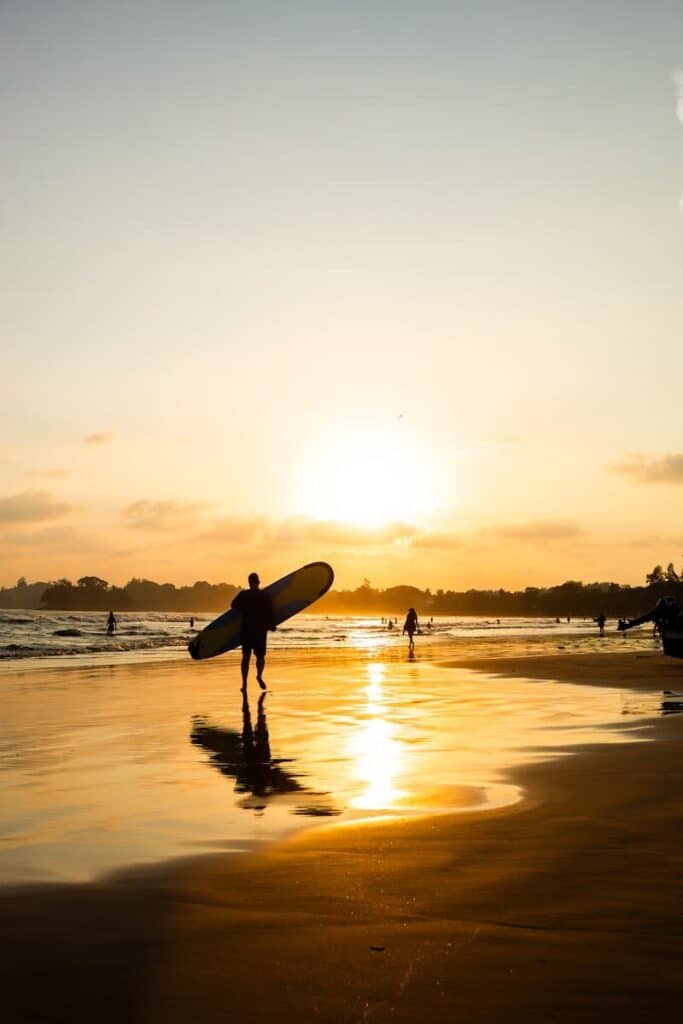 Best Beaches in Sri Lanka: A Guide by Coast & Season 13 Arugam Bay beach with palm trees fishing boats and laid-back surf town atmosphere Sri Lanka