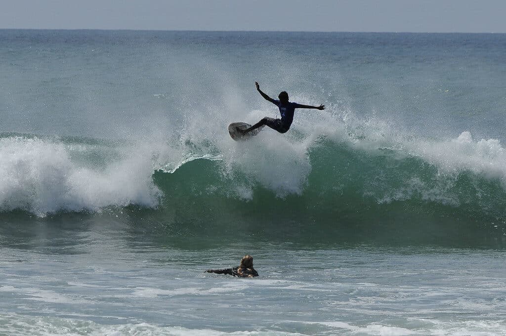 Sri Lanka East Coast: Best Beaches, Bases & When to Go 5 surfers on waves at Arugam Bay point break Sri Lanka east coast