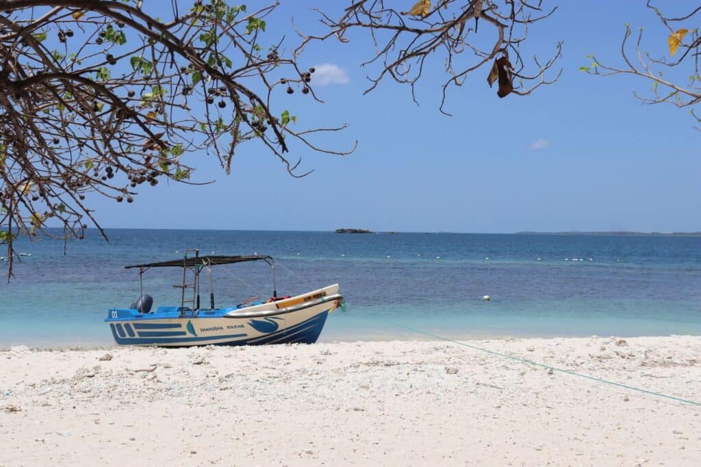 Sri Lanka East Coast: Best Beaches, Bases & When to Go 4 traditional wooden fishing boat resting on flat sandy beach at Pasikudah