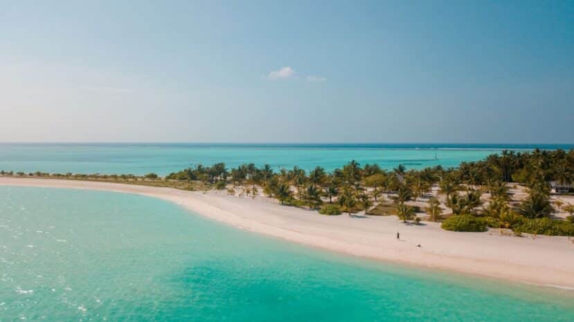 North and South Ari Atoll Guide (Alif Alif & Alif Dhaal): Resorts, Local Islands & Everything You Need to Know 18 Dhigurah local island Alifu Dhaalu Atoll Maldives aerial view with long beach