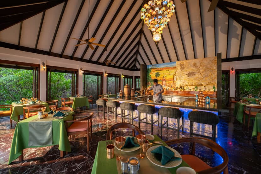 How to Choose the Best Atoll in Maldives: A Complete Area & Stay Guide 30 Atmosphere Kanifushi Maldives Lhaviyani Atoll Lantern Bar with bartenders at night