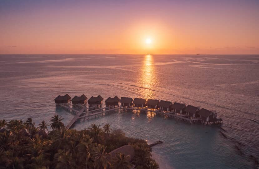 North and South Ari Atoll Guide (Alif Alif & Alif Dhaal): Resorts, Local Islands & Everything You Need to Know 3 Ari Atoll Maldives resort island aerial view with overwater villas and beach
