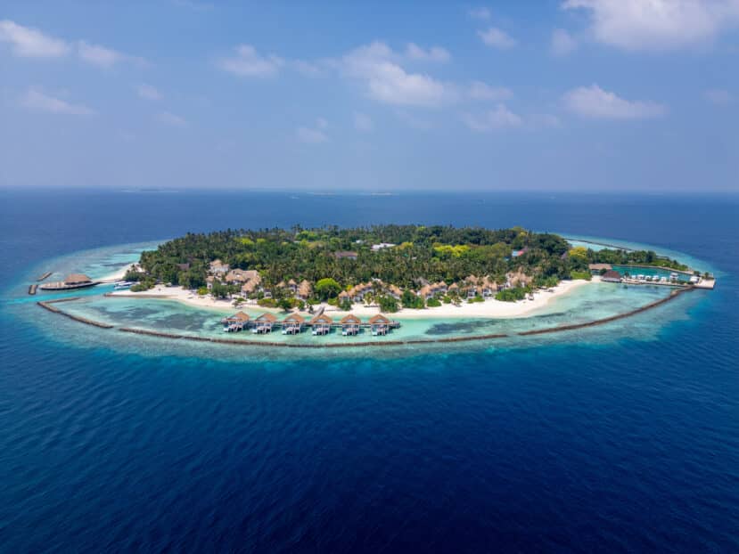North and South Malé Atoll Guide (Kaafu Atoll): Resorts, Local Islands & Everything You Need to Know 4 Bandos Maldives resort island aerial view with overwater bungalows and dive school