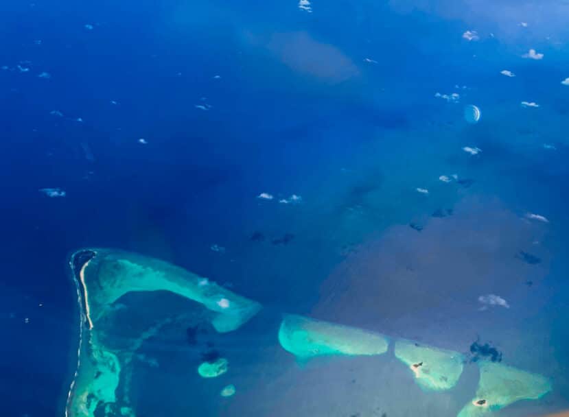 Lhaviyani Atoll Maldives: A Complete Guide to Three Stunning Atolls 15 Dhaalu Atoll Maldives aerial view of central atoll with coral reef and scattered islands