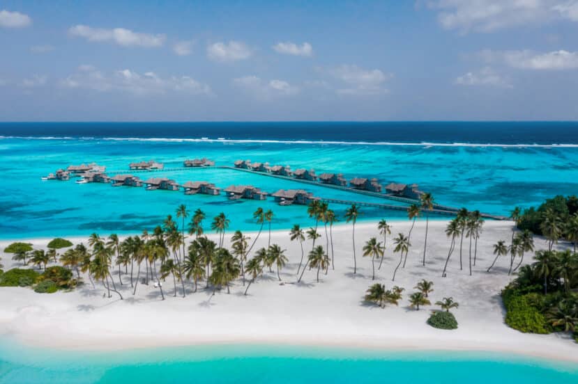 North and South Malé Atoll Guide (Kaafu Atoll): Resorts, Local Islands & Everything You Need to Know 10 Gili Lankanfushi North Malé Atoll jetty with overwater villas and palm trees at sunrise