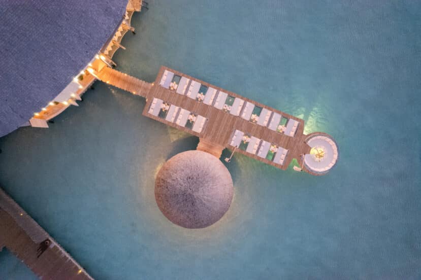 Lhaviyani Atoll Maldives: A Complete Guide to Three Stunning Atolls 12 Soneva Jani Noonu Atoll overwater restaurant with chef cooking dinner above the lagoon