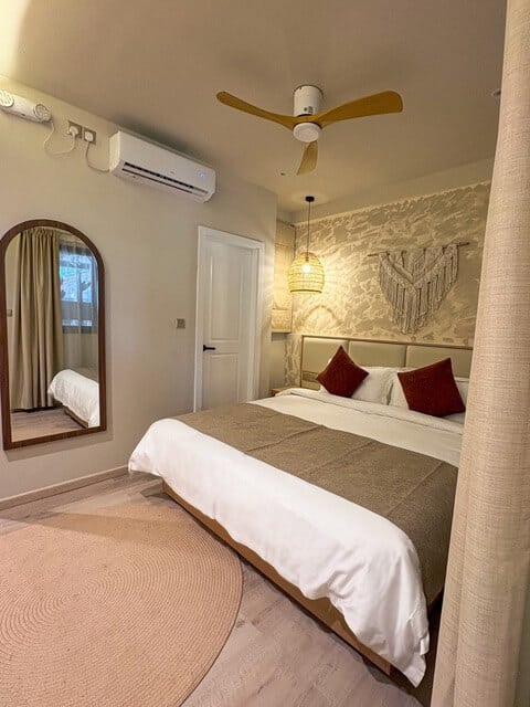 Best Hotels on Local Islands in Maldives (By Budget): Complete Guide for 2026 19 Twin Palms Surfhouse Thulusdhoo surf guesthouse with hammocks and social courtyard