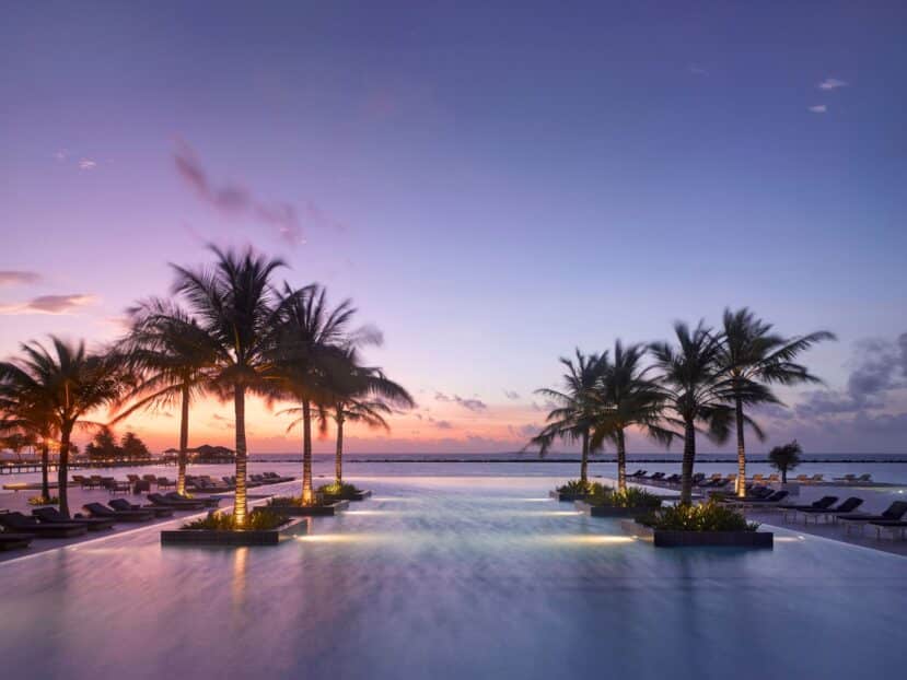 North and South Malé Atoll Guide (Kaafu Atoll): Resorts, Local Islands & Everything You Need to Know 22 Villa Nautica Paradise Island North Malé Atoll main pool at sunset with villa reflections