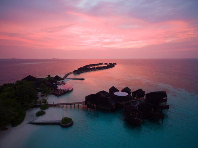 How to Choose the Best Atoll in Maldives: A Complete Area & Stay Guide 8 Lily Beach Resort South Ari Atoll Maldives aerial view at sunset with overwater villas
