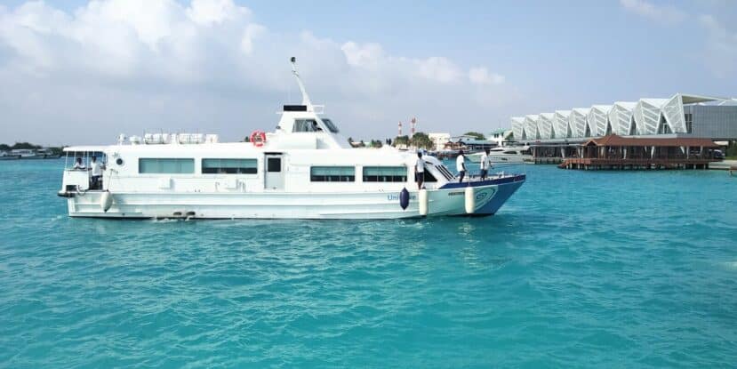 Dhiffushi Maldives: Budget Island with Easy Transfers 10 white public ferry boat crossing turquoise water near a modern terminal building