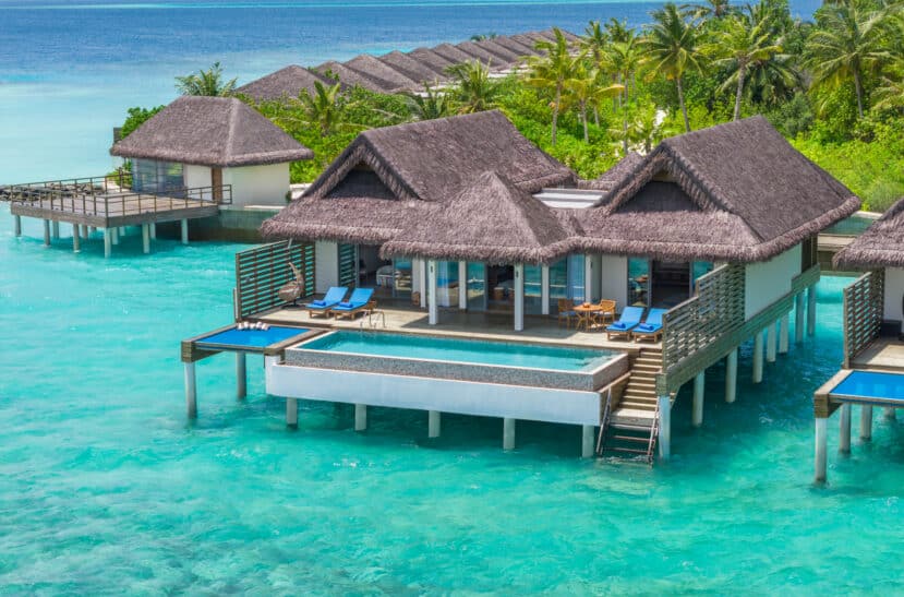 North and South Malé Atoll Guide (Kaafu Atoll): Resorts, Local Islands & Everything You Need to Know 26 dusitD2 Feydhoo Maldives South Malé Atoll resort beach with palm trees and bungalows