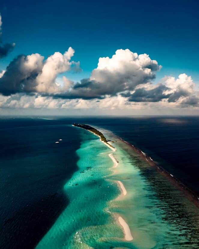 Dhigurah Maldives: The Best Local Island for Whale Shark Encounters 14 aerial view of the long narrow island and sandbank of Dhigurah stretching into a turquoise lagoon