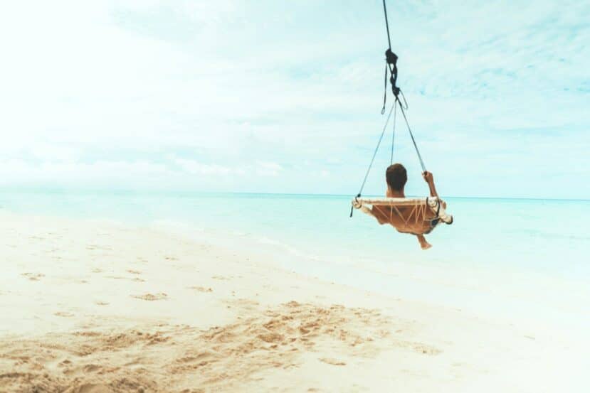 Fulidhoo Maldives: Quiet Local Island for Couples & Snorkelling in Vaavu Atoll 9 beach swing hanging over shallow turquoise water at the edge of a white sand beach