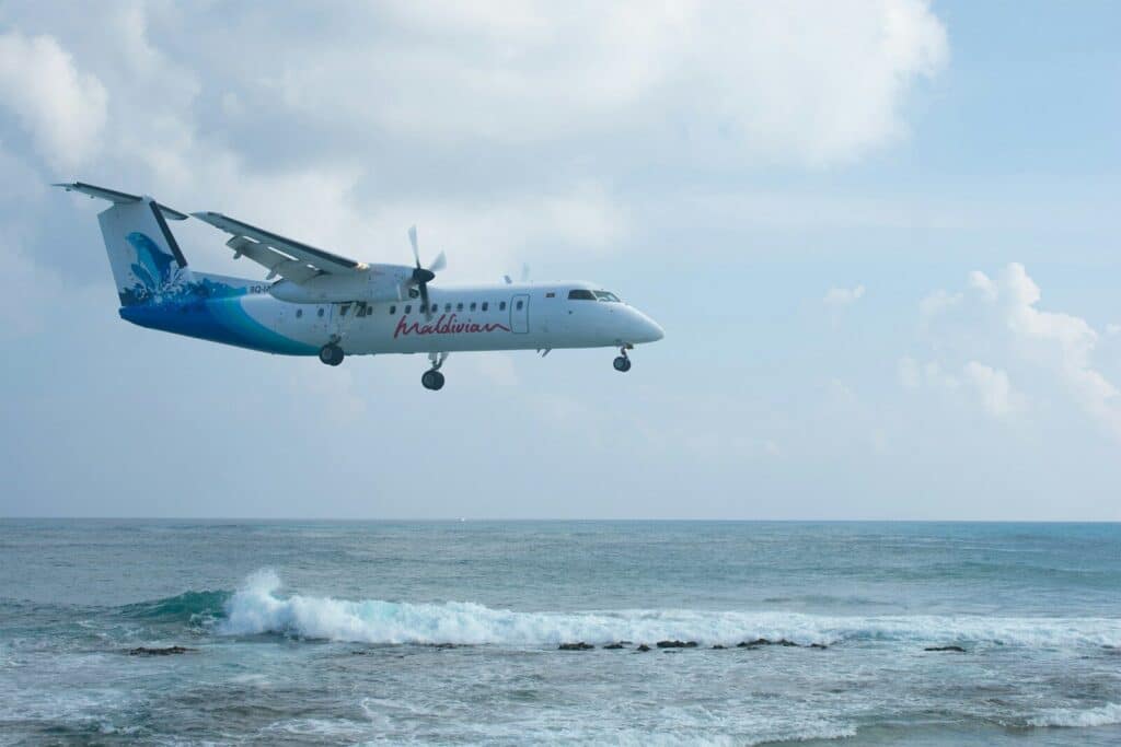 How to Get Around Maldives: The Complete Transport & Transfer Guide 4 small domestic flight plane on runway at Maldives regional airport